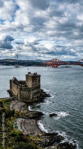Incholm Abbey Ruins overlooking the Firth of Forth with Forth Bridge in Scotland.