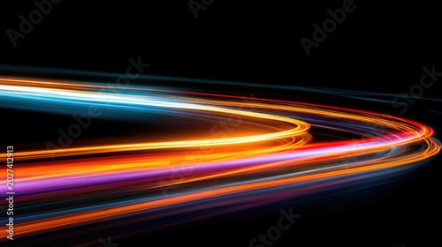 Streaks of vibrant light paint glowing arcs across a dark canvas