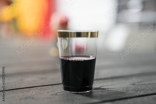 Photos A glass of half full wine at a party