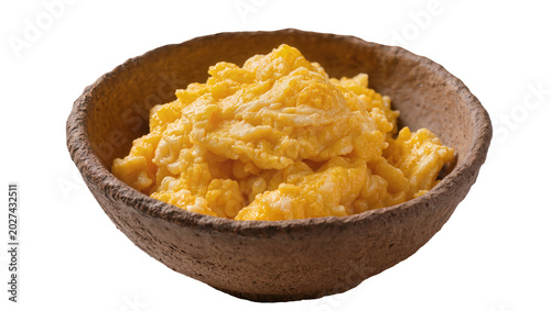 Fotografi Fluffy scrambled eggs in a rustic earthenware bowl, isolated on transparent back