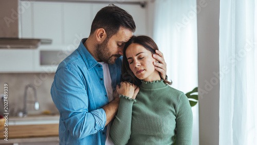 Tender Moment of a Couple Embracing at Home Showing Comfort, Support and Quiet Affection
