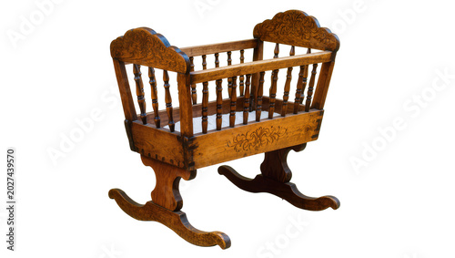 Tableau sur toile Antique wooden rocking cradle with ornate carvings, isolated on transparent back