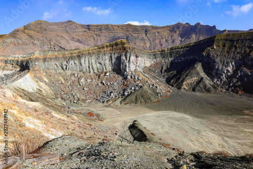 Photos View of the crater opening of erupting volcano
