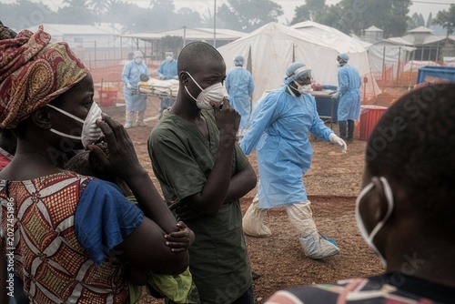 Vigilant faces in an African community confronting a devastating Ebola epidemic