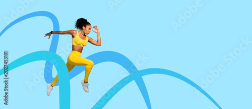 Obraz na plátně A woman is leaping in bright yellow sportswear