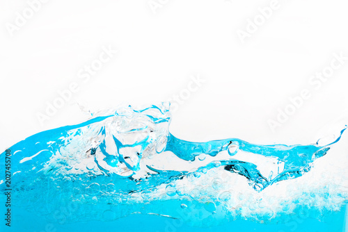 Billede på lærred Blue water splashing creating bubbles and wave motion