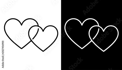 Slika na platnu Intertwined Hearts: Two simple outlines of hearts, one in white on a black background and the other in black on a white background, are linked together, symbolizing connection and affection