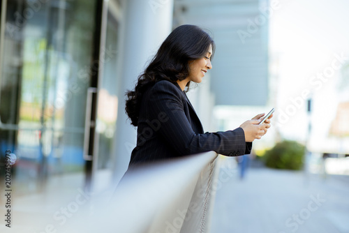 Businesswoman checks messag...