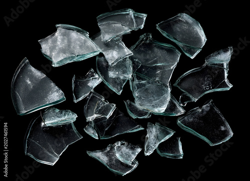 Broken Glass Shards and Fragments Scattered on Black Background