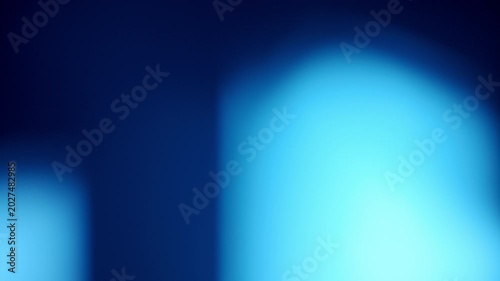 Cool-toned cinematic light leak with refractive flares descending vertically from top to bottom, for overlay or transition use