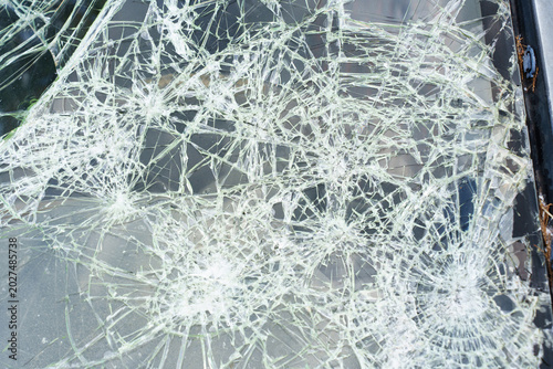 Photography Shattered Car Windshield with Multiple Impact Points and Cracks