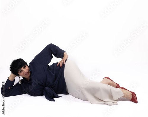 Foto Young man lying on floor suffering from acute lower backache