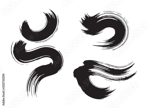 Black calligraphy brush strokes and curved paint lines set on white background for creative design.