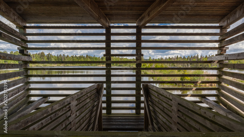 Tableau sur toile Interior view from a wooden bird observation hide in a wetland