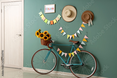 Bicycle with sunflowers nea...