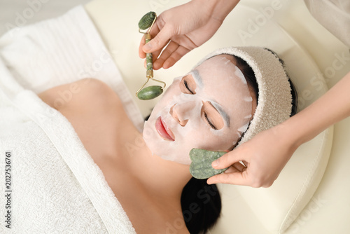 Cosmetologist with massage ...