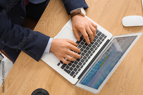 Young businessman using lap...