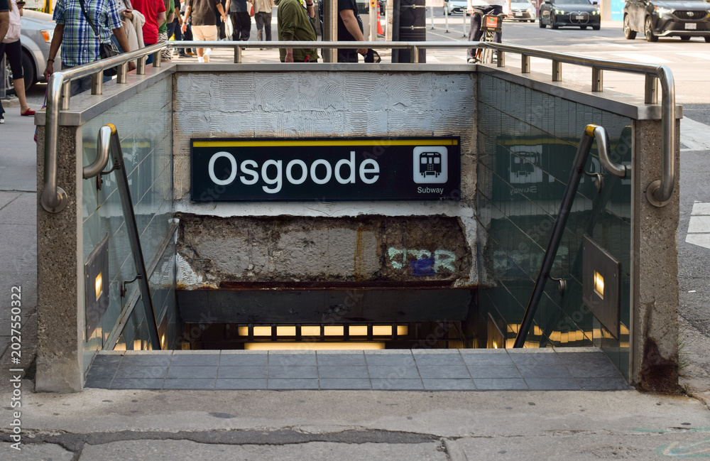 Naklejka premium Subway entrance with stairs descending into underground Osgoode Station in downtown Toronto, showing urban metro transit infrastructure and commuter access point in May 2026