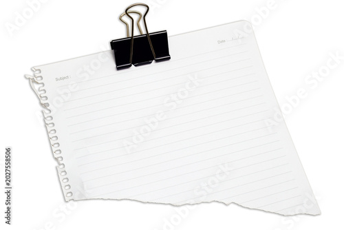 Blank lined notebook paper piece holding black binder clip isolated on white background. Perfect copywriting blank canvas for business planning office messages daily reminders study notes organization