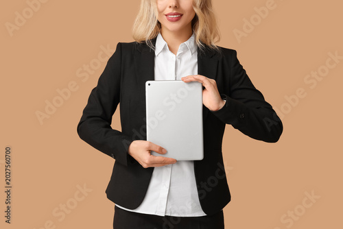 Young businesswoman with ta...