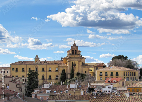 Scenic view of the historic San Pablo Convent over traditional rooftops in Cuenca.