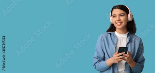 Happy young woman with mobi...