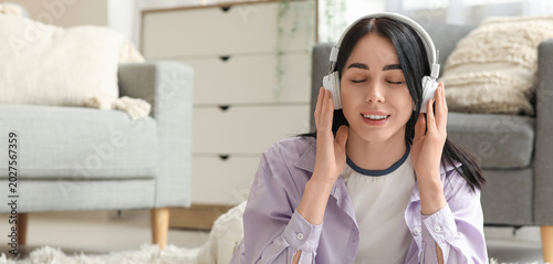 Young woman in headphones l...