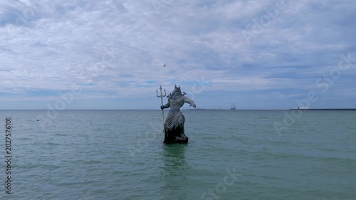 Greek God Poseidon Statue inside the Ocean at Progreso Beach Yucatan. Mexico.