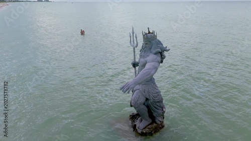Greek God Poseidon Statue inside the Ocean at Progreso Beach Yucatan. Mexico.