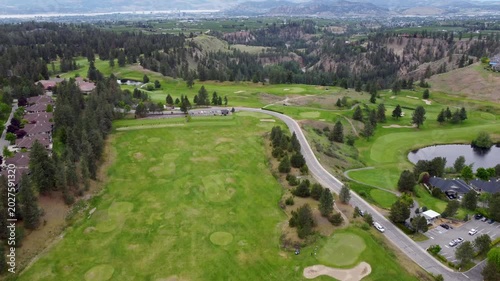 drone aerial pan of golf courses over Kelowna Okanagan
