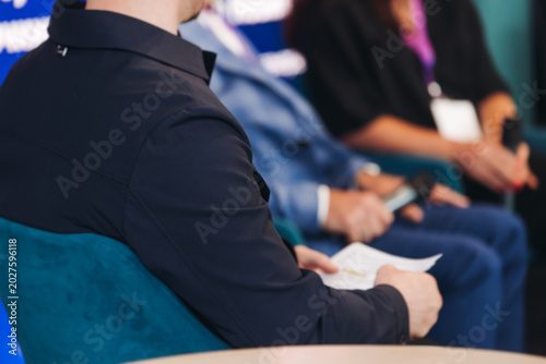 Photos Panel discussion at conference, group of speakers debate at the business confere