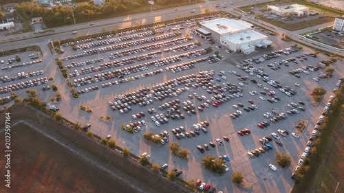 Car showroom exterior with brand new vehicles in stock, clean parking lot and modern infrastructure, representing automotive business, leasing services and dealership marketing.