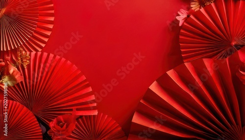 Festive red paper fans and floral accents for Chinese New Year.