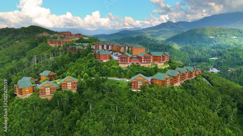 Beautiful homes in Gatlinburg, Tennessee nestled in the Great Smoky Mountains with scenic forest landscape and summer colors