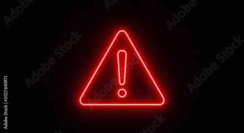 Exclamation mark warning sign glowing in bright red neon light representing danger caution risk alert and security notice concept