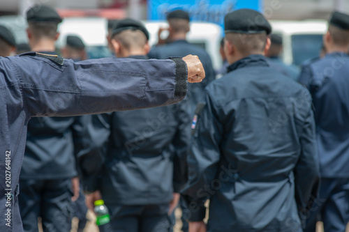 Obraz na plátně Riot police control the crowd refresher training using hand signals as symbols i