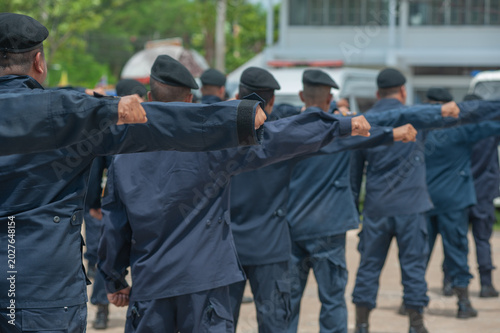 Tableau sur toile Riot police control the crowd refresher training using hand signals as symbols i