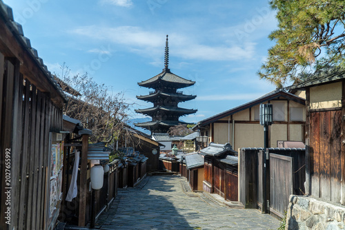 фотографія Yasaka Pagoda dominates the skyline at the end of a charming stone-paved street,