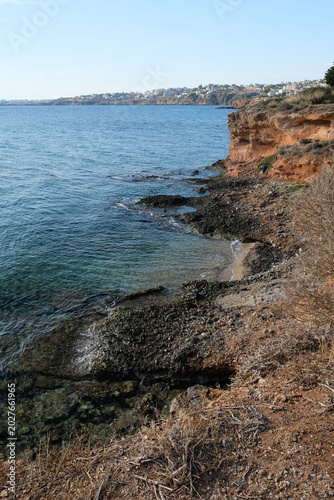 rocky seashore and clear water