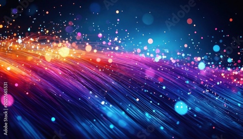Vibrant flowing multicolored light streaks and glowing bokeh particles over a dark background conveying energetic futuristic motion and magical sparkle