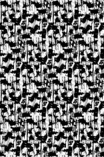 Seamless abstract black and white grunge pattern. Distressed monochrome vertical brush strokes background with rough camouflage texture.