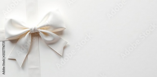Elegant white bow on blank greeting card, ample copy space , thank you, texture