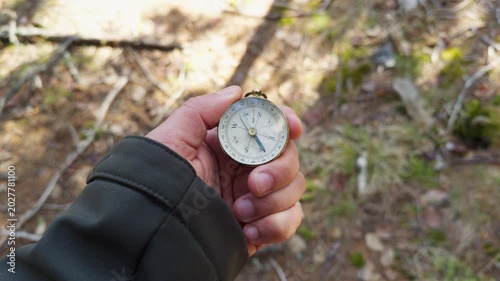 Hiker Holding Compass In Forest Sunlight Concept Of Personal Growth Journey Adventure Travel Navigation Direction Active Lifestyle Wilderness Nature 4K 