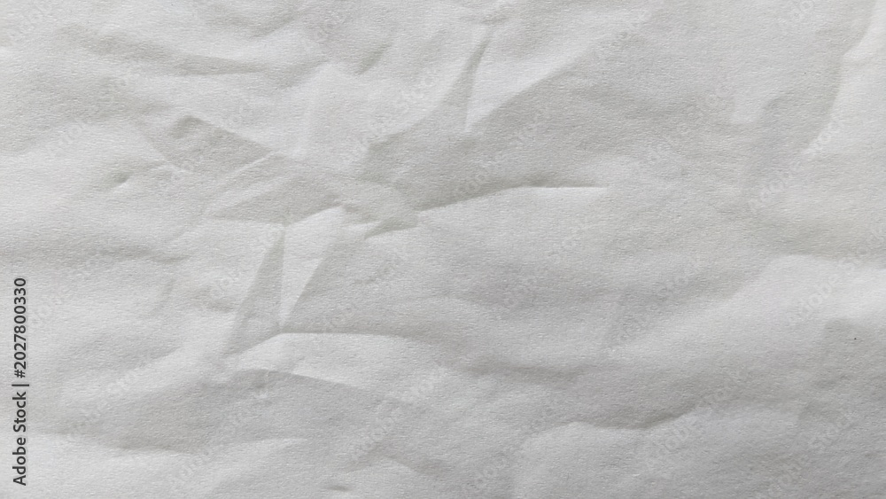 Fototapeta premium Crumpled white paper texture background with creases and wrinkles