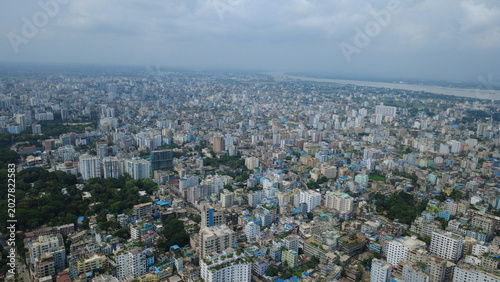 The aerial view of Chattogram city highlights the rapid urban expansion surrounding its remaining green hills and forests. Unplanned construction, hill cutting, and the destruction of trees.