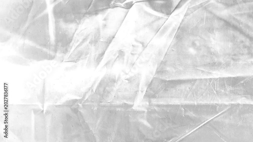 White Wrinkled Plastic Film Texture.Animated abstract background featuring crumpled transparent plastic wrap overlay effect.