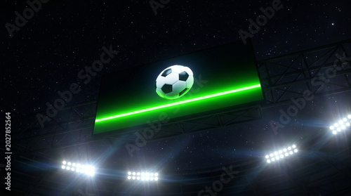 Bright stadium screen displaying a soccer ball with a green line during a night match, illuminated by floodlights, as a video assistant referee tool