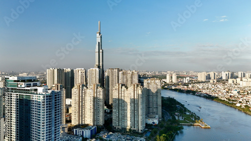 Bild auf Leinwand Ho Chi Minh City, Vietnam – 4K aerial sunrise drone view of downtown skyline wit