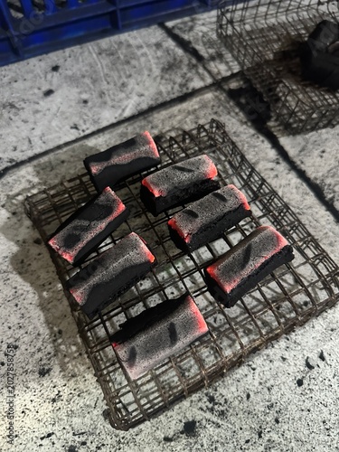 Fire burning from coconut charcoal briquette for business production	
