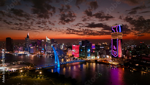 Cuadro en lienzo Ho Chi Minh City, Vietnam: 4K Aerial Night Drone View of Skyline, Skyscrapers, T